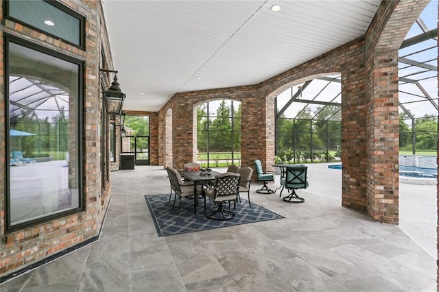 view of patio / terrace with glass enclosure