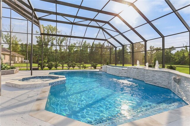 view of pool featuring pool water feature, a lanai, an in ground hot tub, and a patio