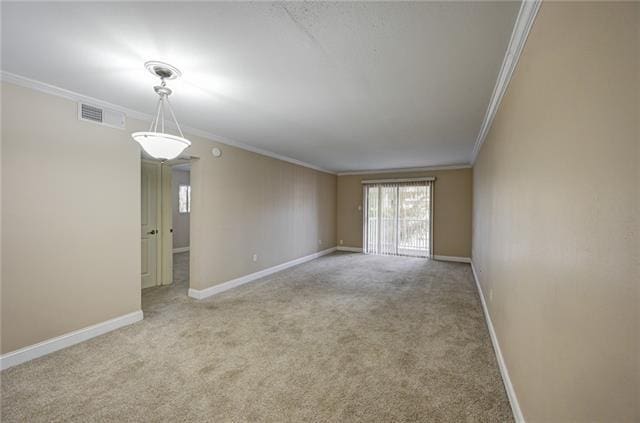 unfurnished room featuring crown molding and light carpet