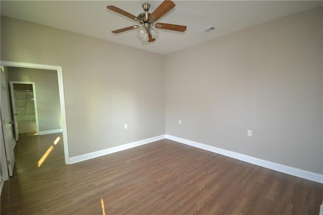 unfurnished bedroom with ceiling fan and dark hardwood / wood-style floors