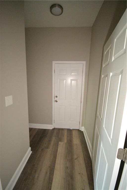 corridor with dark wood-type flooring