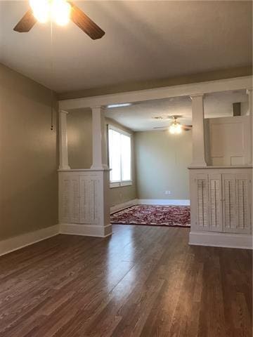 unfurnished room with ceiling fan and dark hardwood / wood-style floors