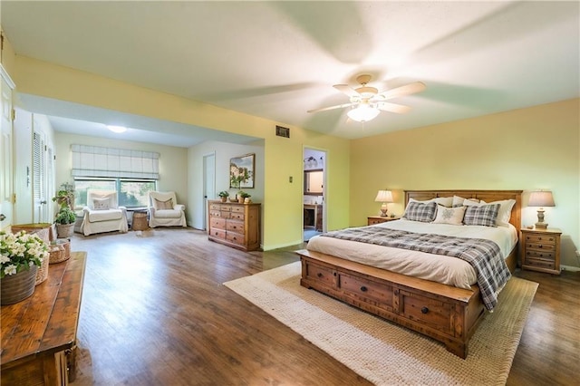 bedroom with ceiling fan and dark hardwood / wood-style flooring