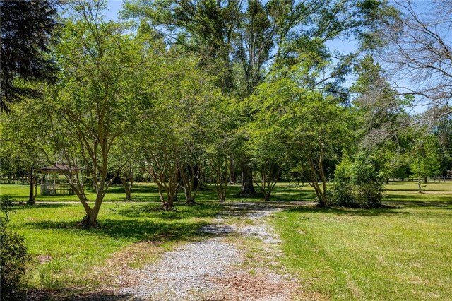 exterior space featuring a lawn and a gazebo