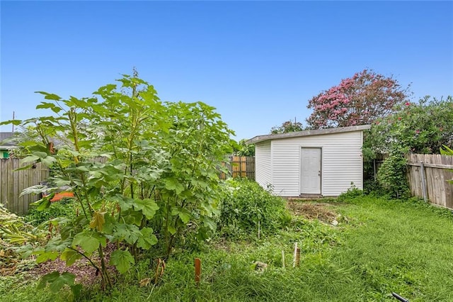 view of shed with fence