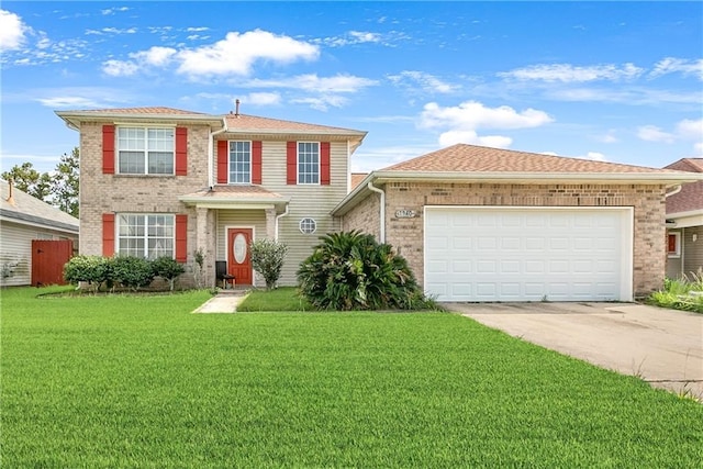 view of front of property with a garage and a front lawn