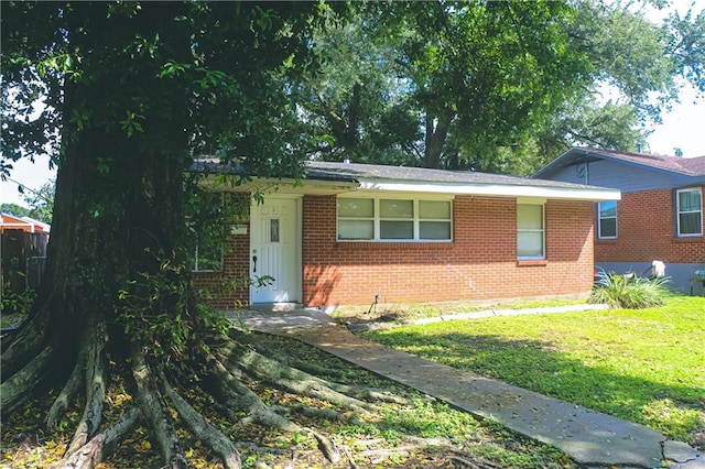 view of front of home with a front yard