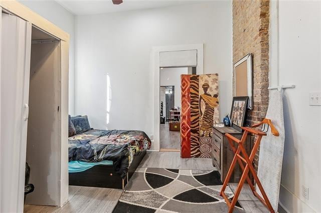 bedroom featuring light hardwood / wood-style floors and a closet