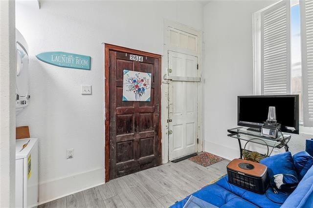 foyer entrance featuring hardwood / wood-style floors