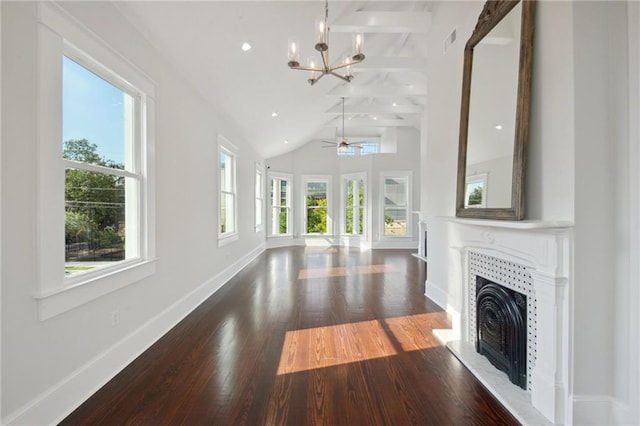 unfurnished living room featuring ceiling fan with notable chandelier, beam ceiling, dark wood-type flooring, and high vaulted ceiling