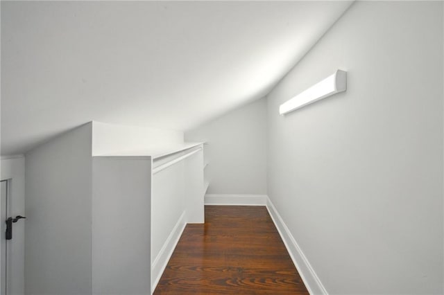 entryway featuring lofted ceiling with beams and dark wood-type flooring