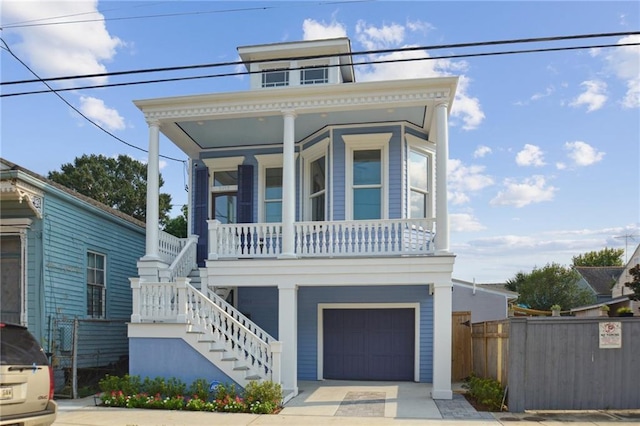 view of front of home with covered porch and a garage