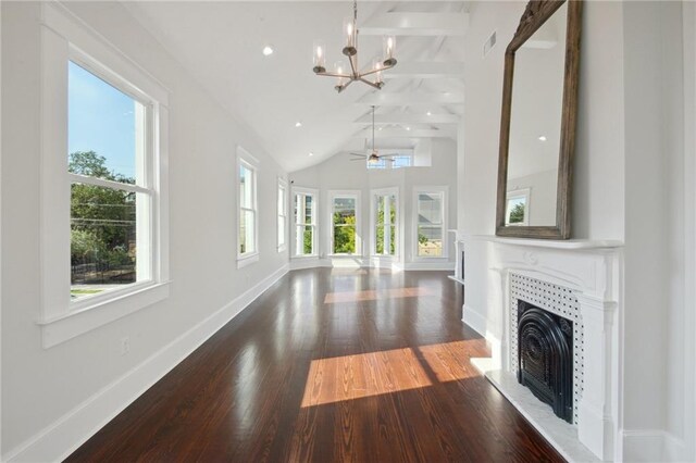 unfurnished living room featuring ceiling fan with notable chandelier, beamed ceiling, high vaulted ceiling, and dark wood-type flooring