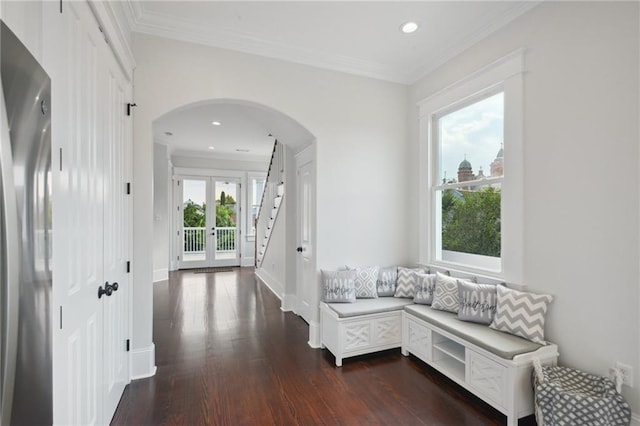 2412 N Rampart St, New Orleans, LA 70117 - corridor with crown molding, dark wood-type flooring, arched walkways, recessed lighting, and baseboards