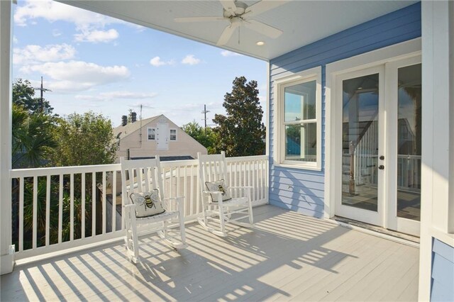 wooden deck with ceiling fan