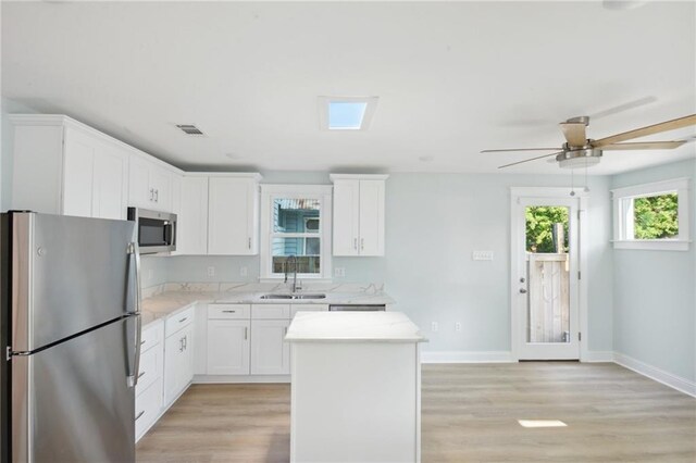 wooden terrace featuring ceiling fan