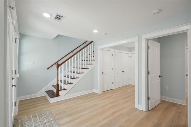 2412 N Rampart St, New Orleans, LA 70117 - foyer entrance featuring light wood-type flooring, visible vents, recessed lighting, stairway, and baseboards