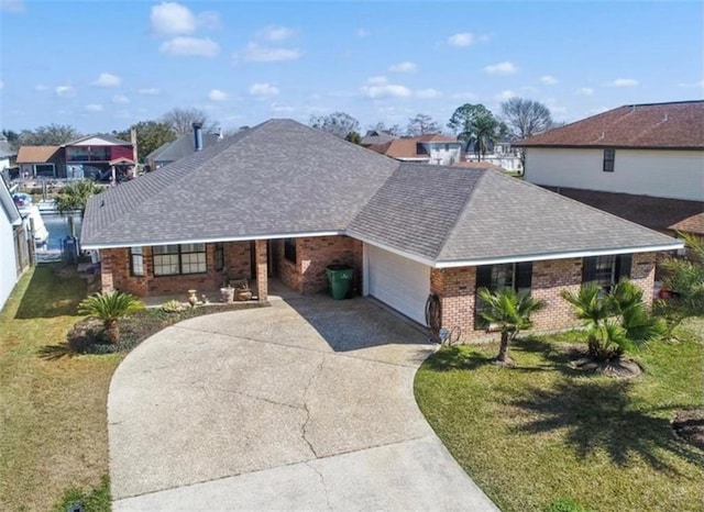 view of front of property featuring a garage and a front yard