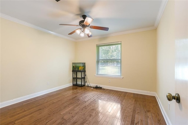 spare room with ceiling fan, hardwood / wood-style flooring, and crown molding