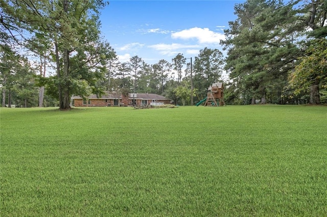 view of yard with a playground