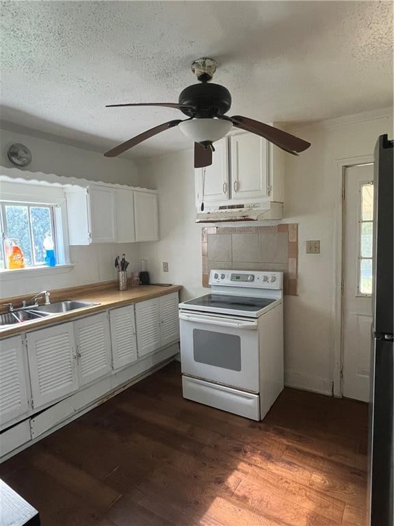 kitchen featuring white cabinetry, ceiling fan, dark hardwood / wood-style floors, and white electric stove