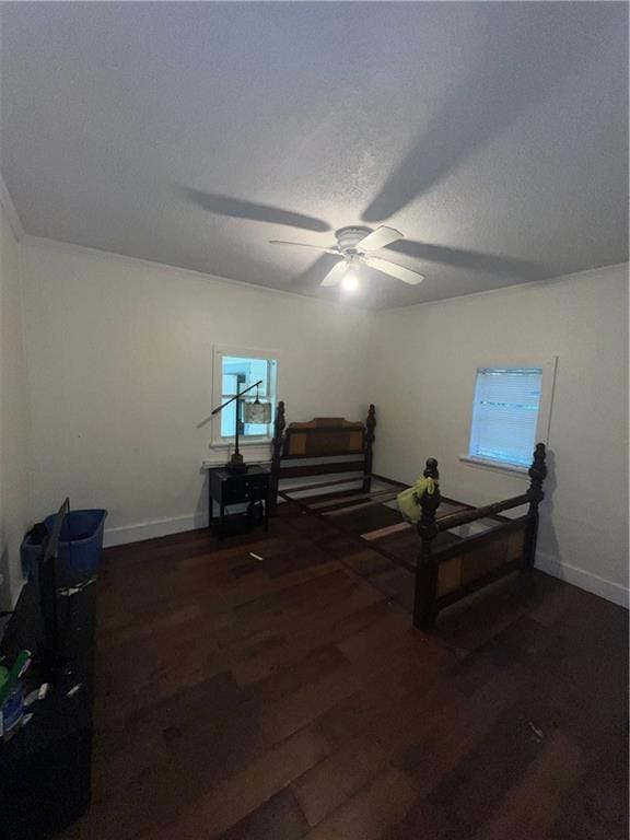 interior space featuring a textured ceiling, dark hardwood / wood-style flooring, and ceiling fan