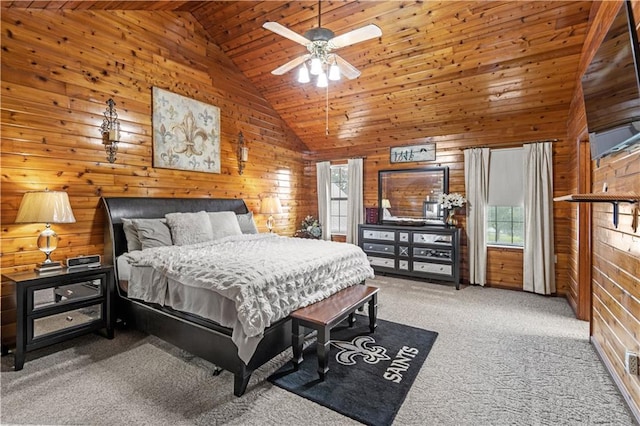 bedroom with wood ceiling, wood walls, carpet floors, high vaulted ceiling, and ceiling fan