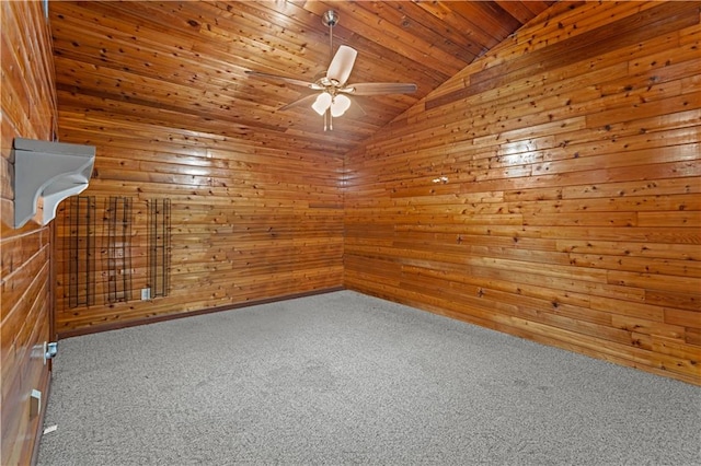 carpeted empty room with wooden ceiling, lofted ceiling, wood walls, and ceiling fan