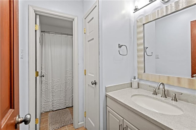 bathroom featuring tile patterned flooring and vanity