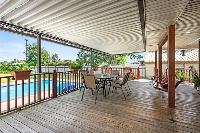 deck with a fenced in pool