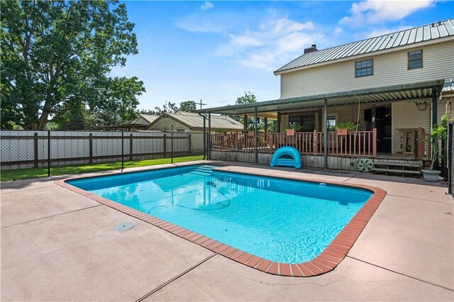 view of pool featuring a patio area