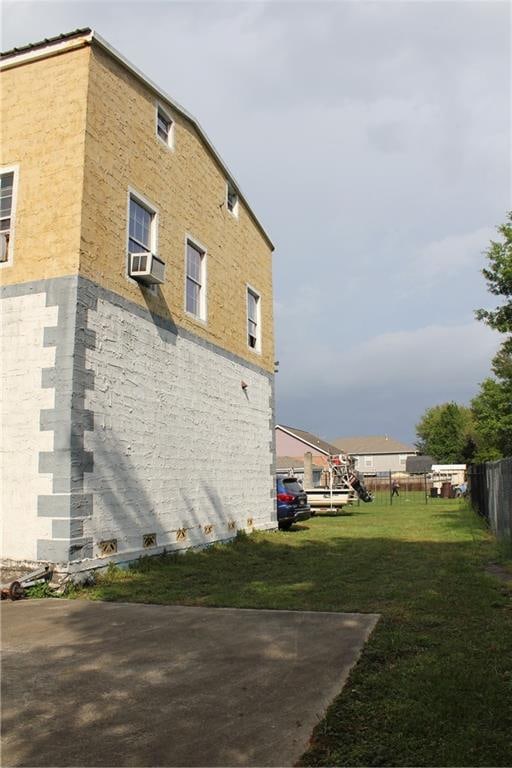 view of property exterior featuring a lawn