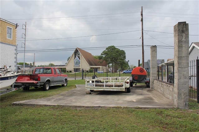 view of car parking with a lawn