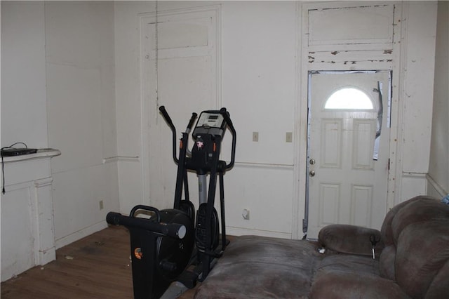 workout room with dark hardwood / wood-style floors