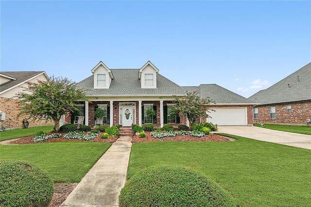 cape cod home featuring a front yard, covered porch, and a garage