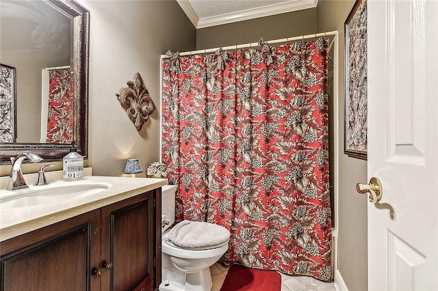 bathroom with toilet, vanity, tile patterned floors, ornamental molding, and a textured ceiling