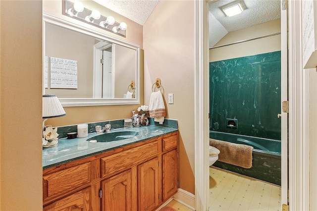 full bathroom with toilet, vanity, tub / shower combination, and a textured ceiling