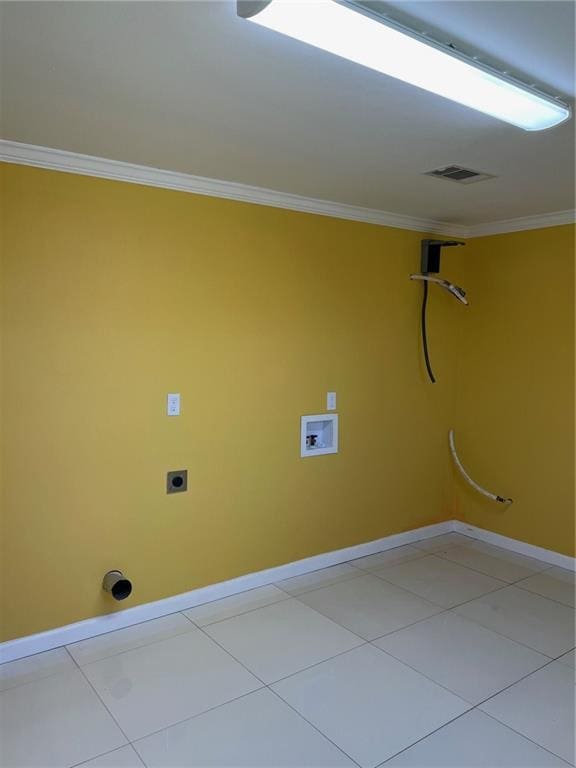 clothes washing area featuring crown molding, light tile patterned floors, and washer hookup