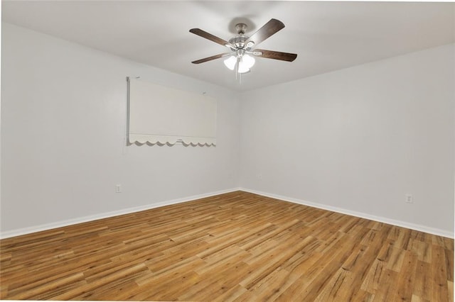 empty room featuring light hardwood / wood-style floors and ceiling fan