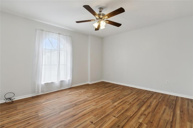 unfurnished room featuring ceiling fan and hardwood / wood-style flooring