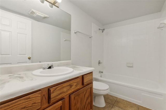 full bathroom with shower / bathing tub combination, vanity, tile patterned flooring, and toilet