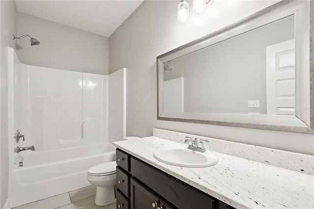 full bathroom with tile patterned flooring,  shower combination, vanity, and toilet