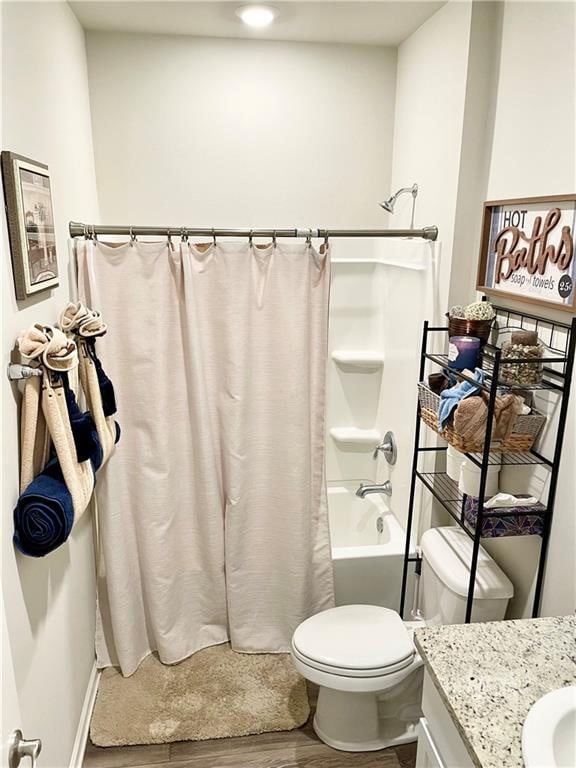 full bathroom with toilet, shower / bath combo with shower curtain, vanity, and hardwood / wood-style flooring