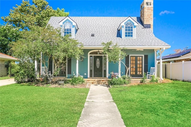 view of front of home featuring covered porch and a front yard