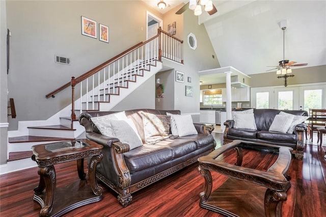 living room featuring high vaulted ceiling, ceiling fan, plenty of natural light, and hardwood / wood-style floors