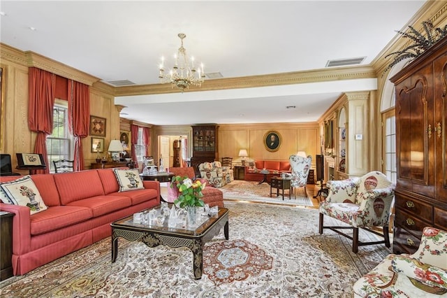 living room featuring a notable chandelier and ornamental molding