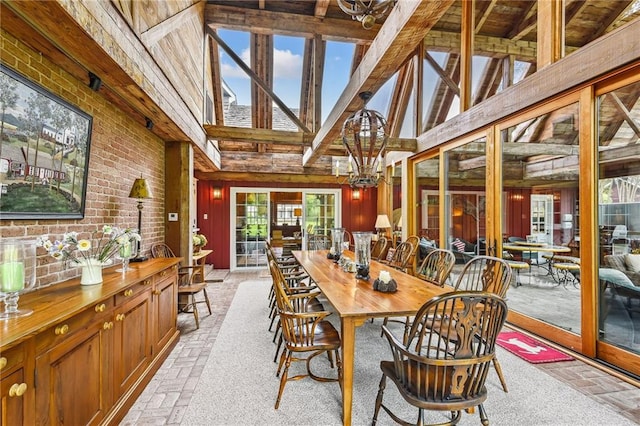 sunroom featuring french doors and beam ceiling