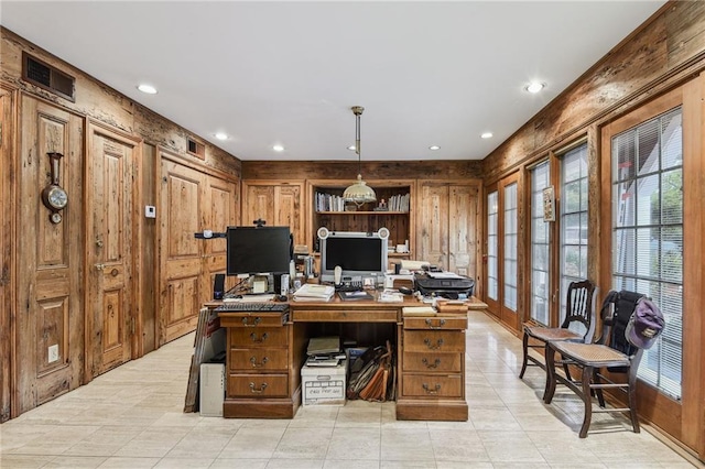 office space with wood walls