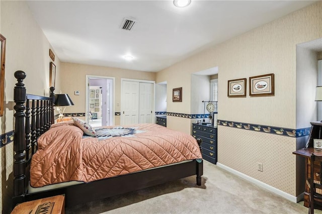 carpeted bedroom with a closet