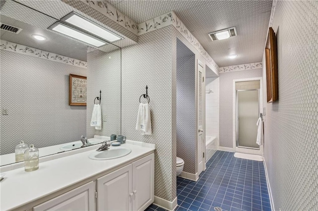 full bathroom featuring bath / shower combo with glass door, vanity, toilet, and tile patterned floors